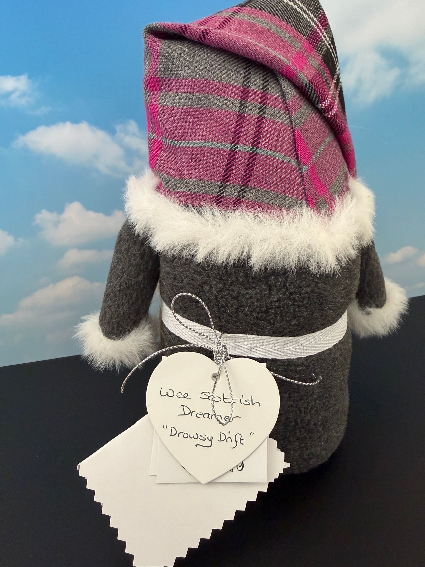 Rear view showing tartan fabric hat and fleece body of a handmade Scottish Dreamer Gnome from a Northern Nomes collection of character Gnomes.