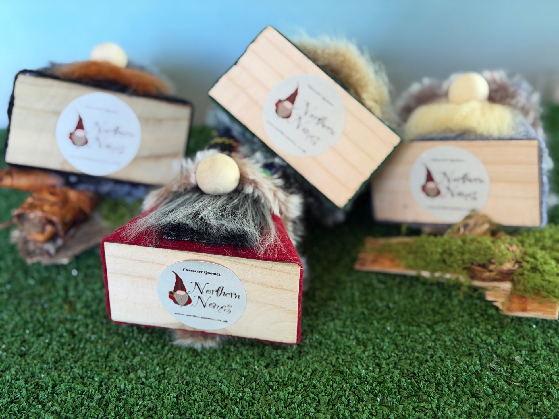 Three wooden gonks from the Thistlewood wee folk range, with white labels reading 'Character Gnomes by Northern Nomes and are arranged to show they are made from reclaimed wood.